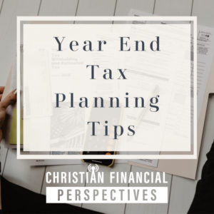 Tax forms on a table with title Year End Tax Planning Tips from Christian Financial Perspectives Podcast